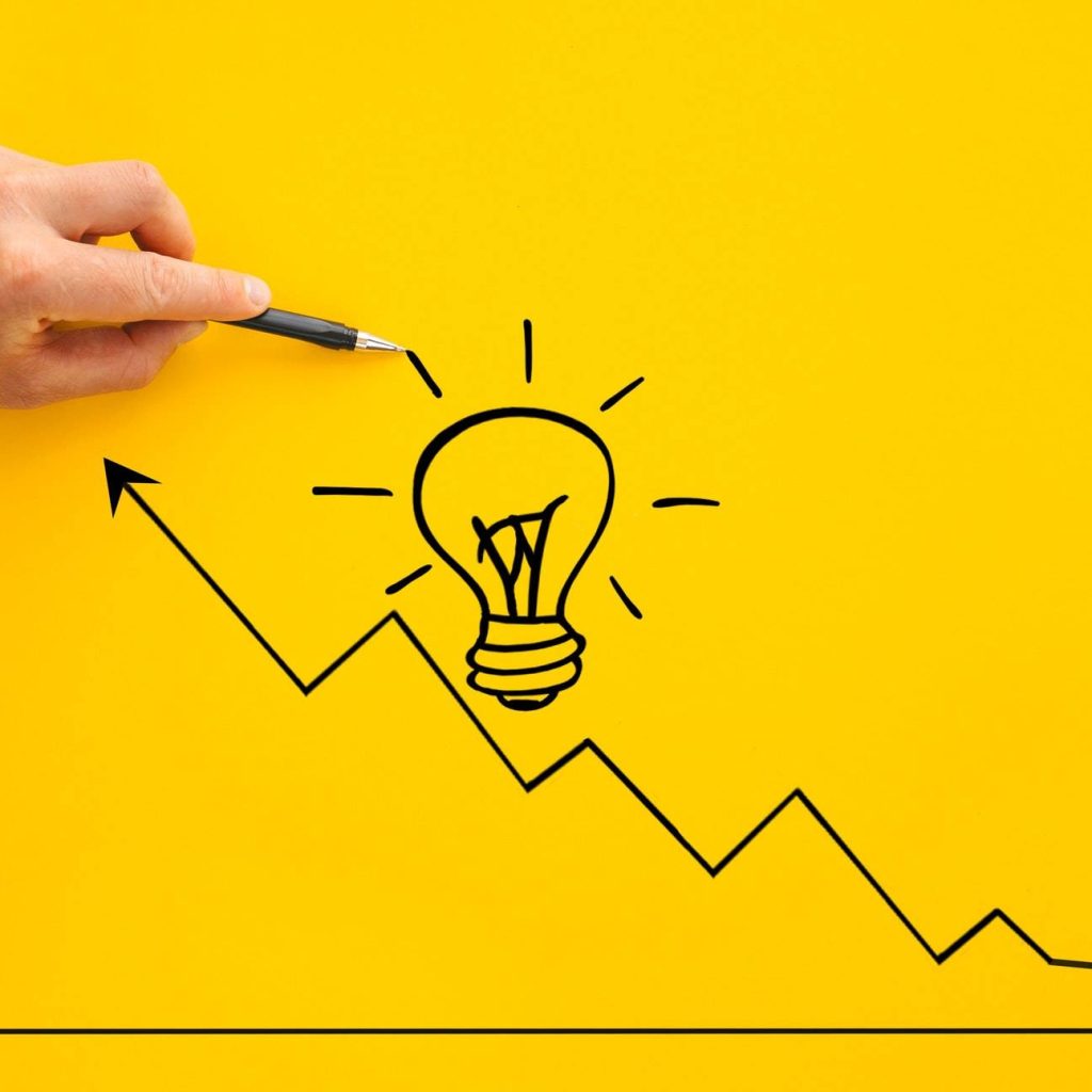 Businessman pointing lightbulb and arrow growth with pen. Business start-up goals to success and id